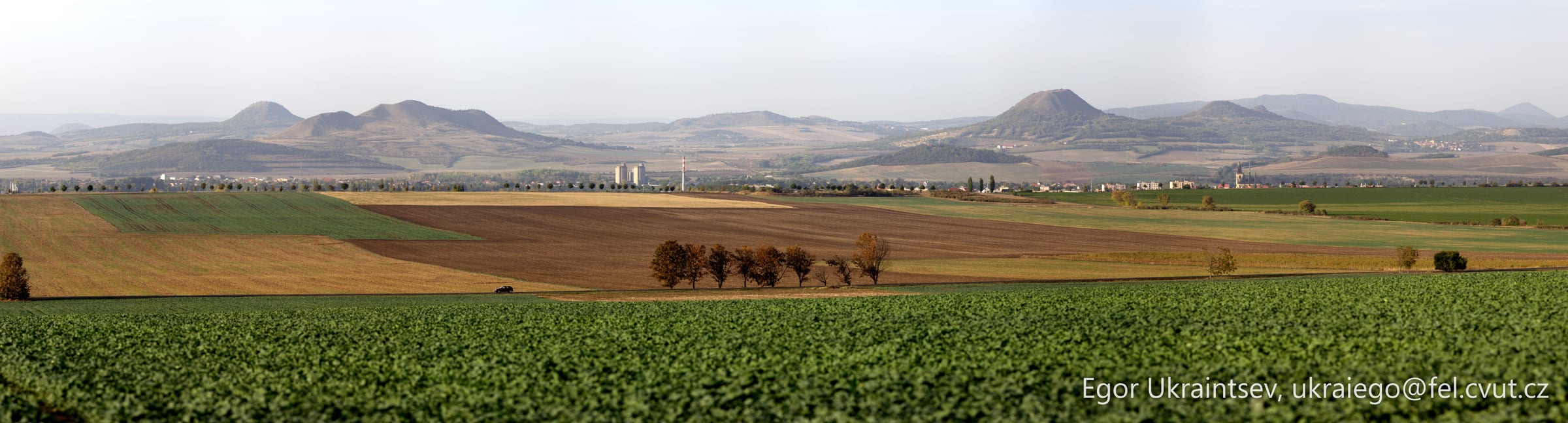 Green field with mountains · Haj