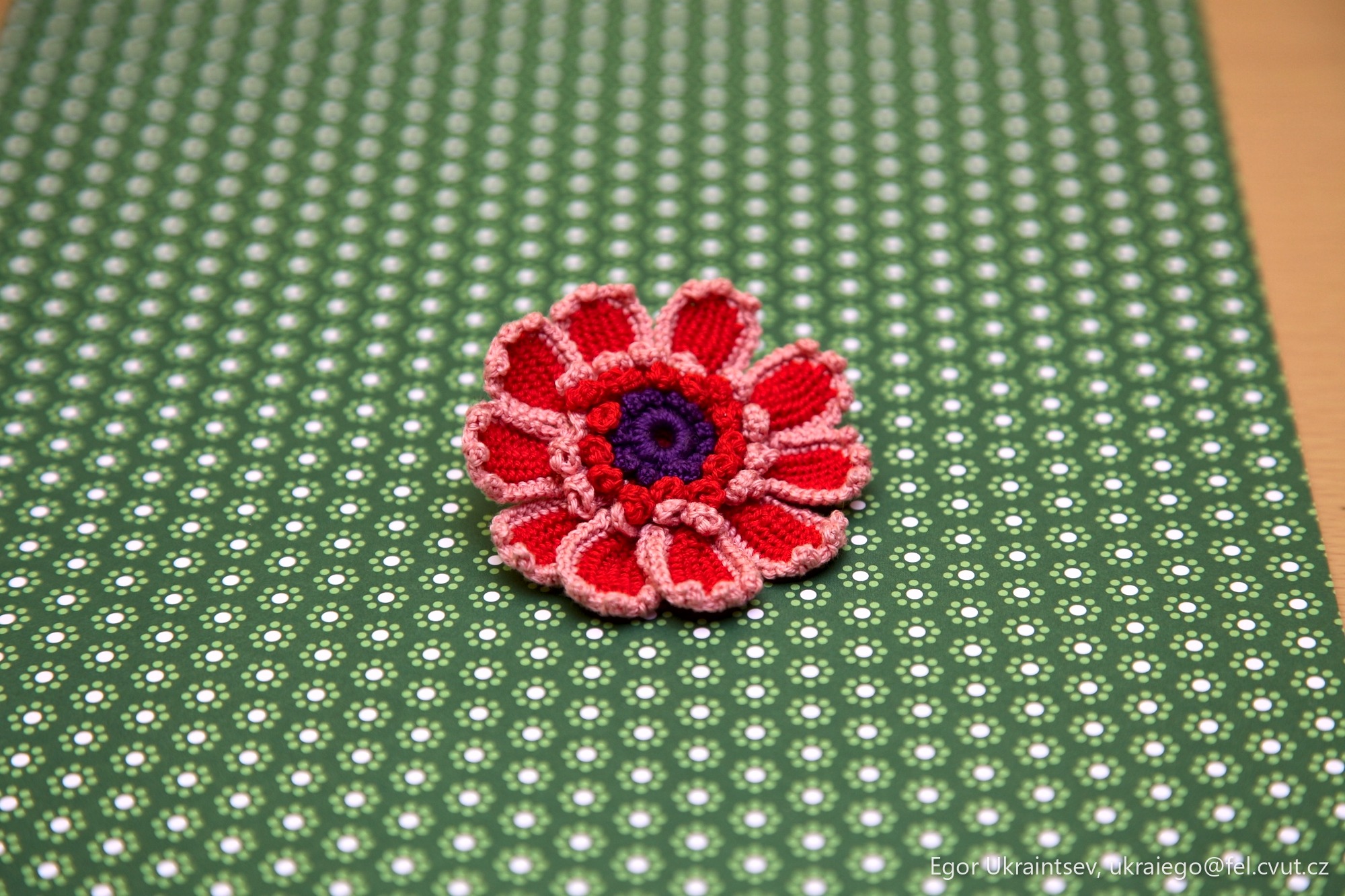 Crochet flower on a green