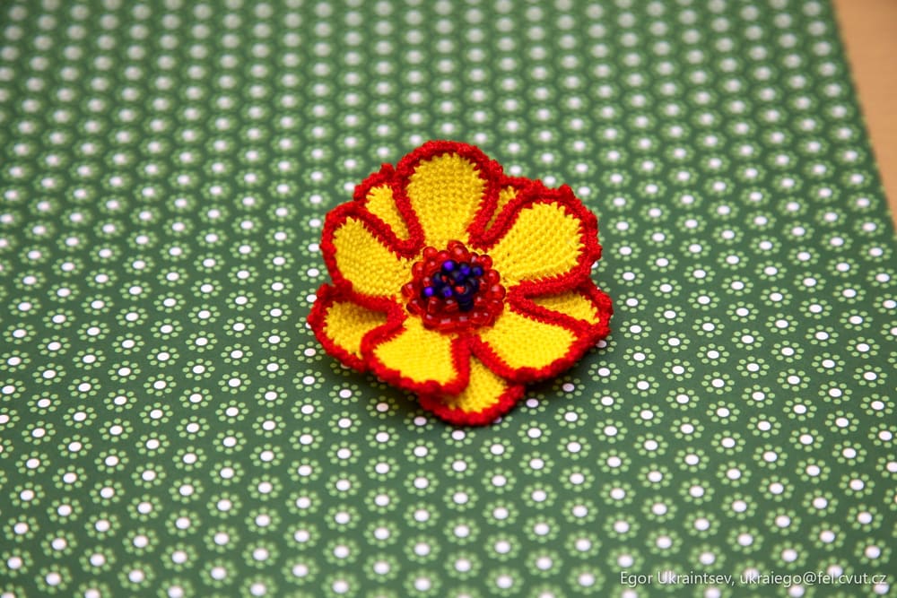 Crochet flower on a green