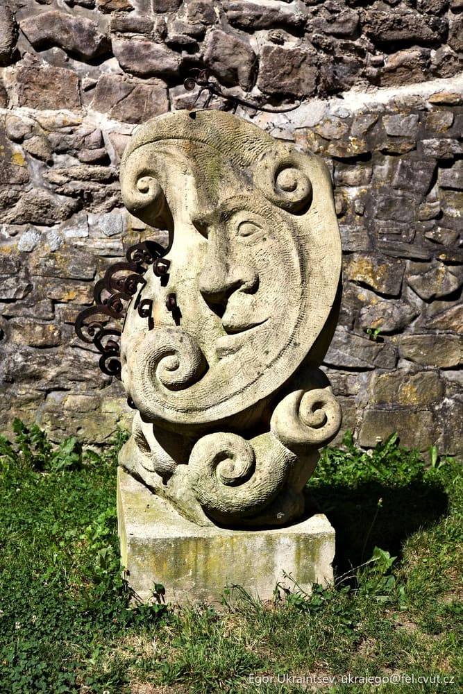 Stone statue in front of a stone