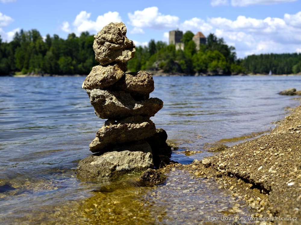 Rocks stacked on the shore