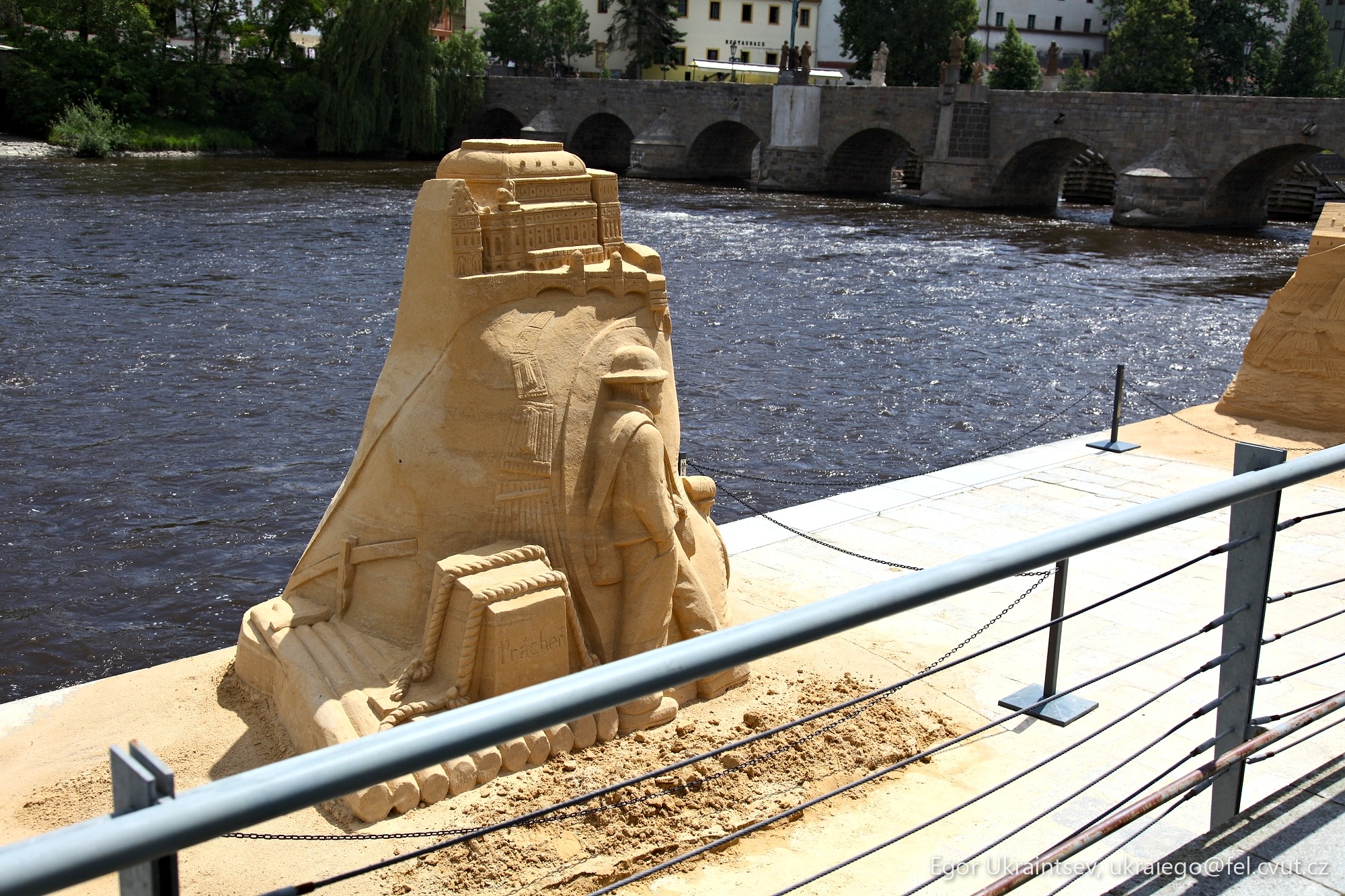 Sand sculpture on a bridge
