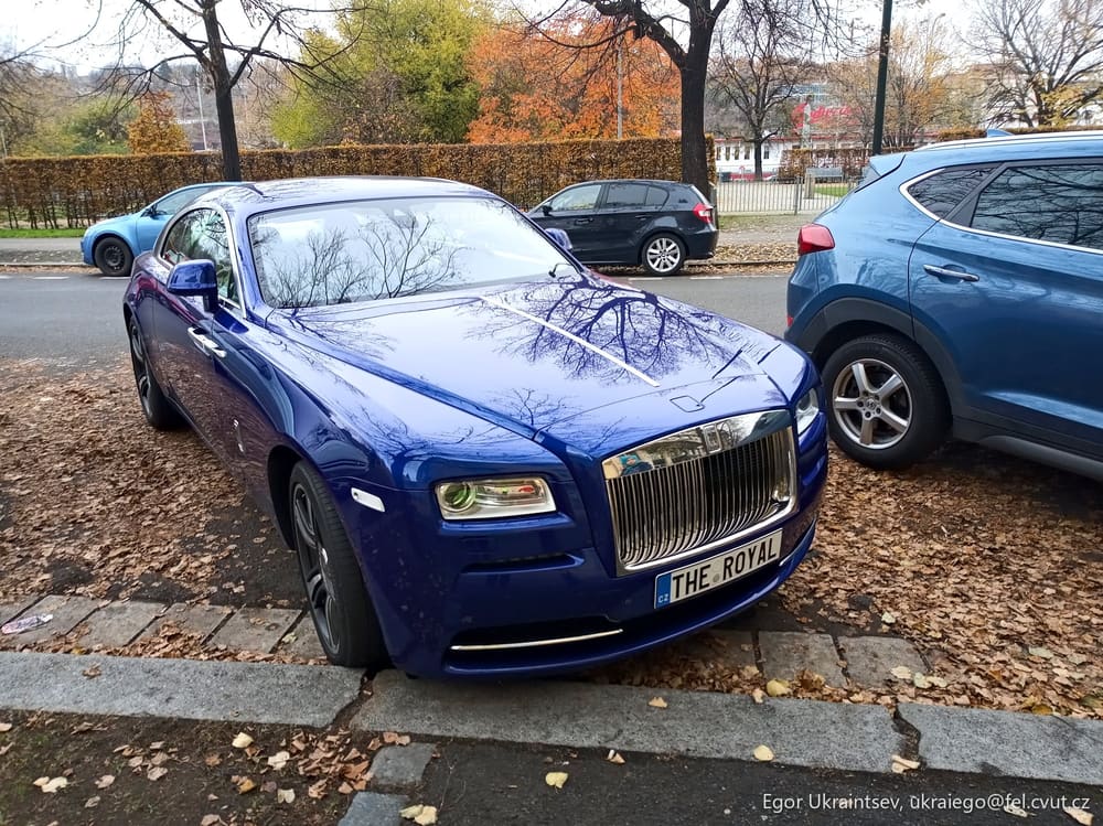 Blue rolls royce parked