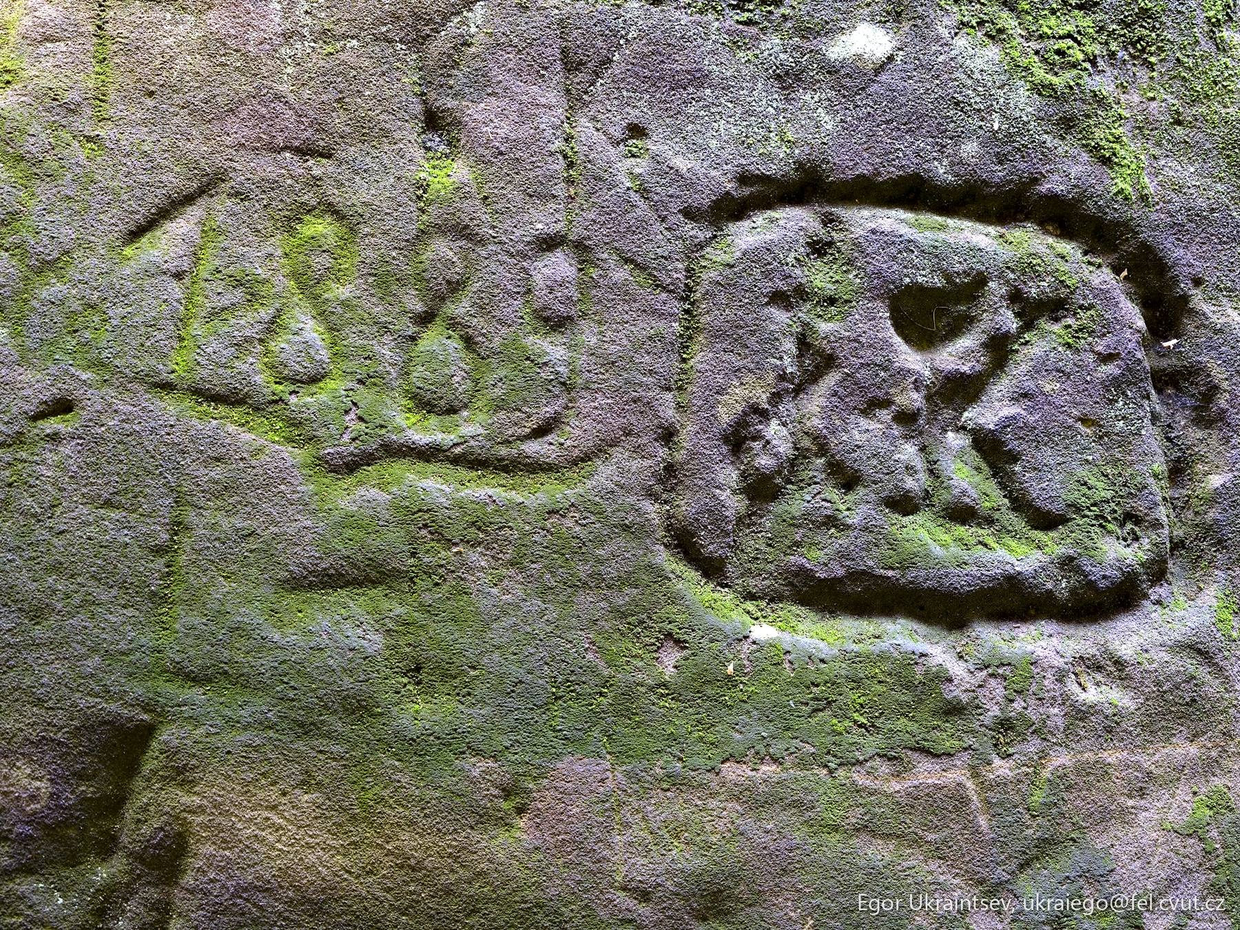 Face carved into a stone