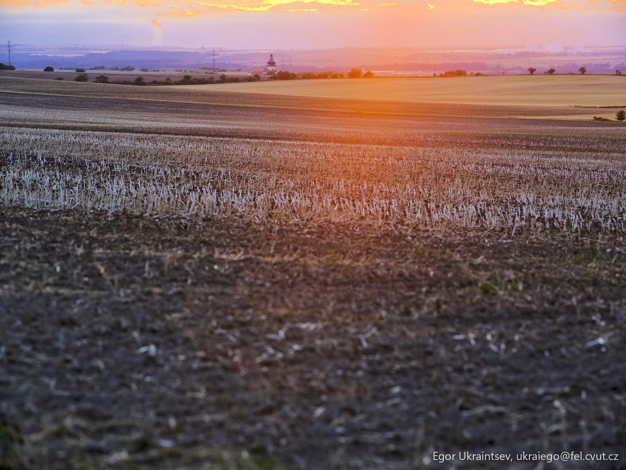 Sun setting over a field