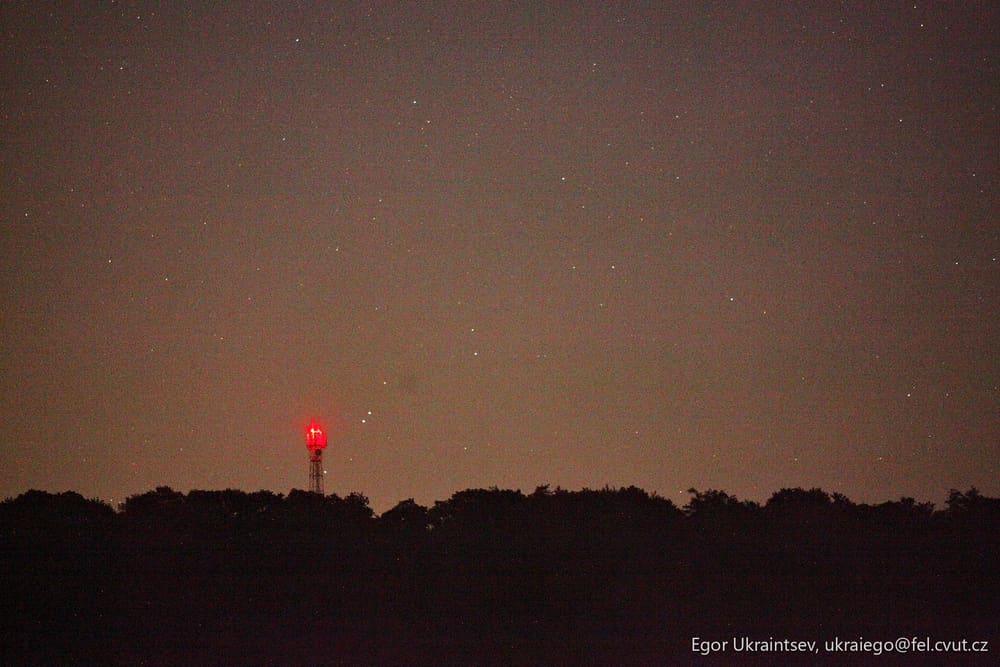 Night sky with a red