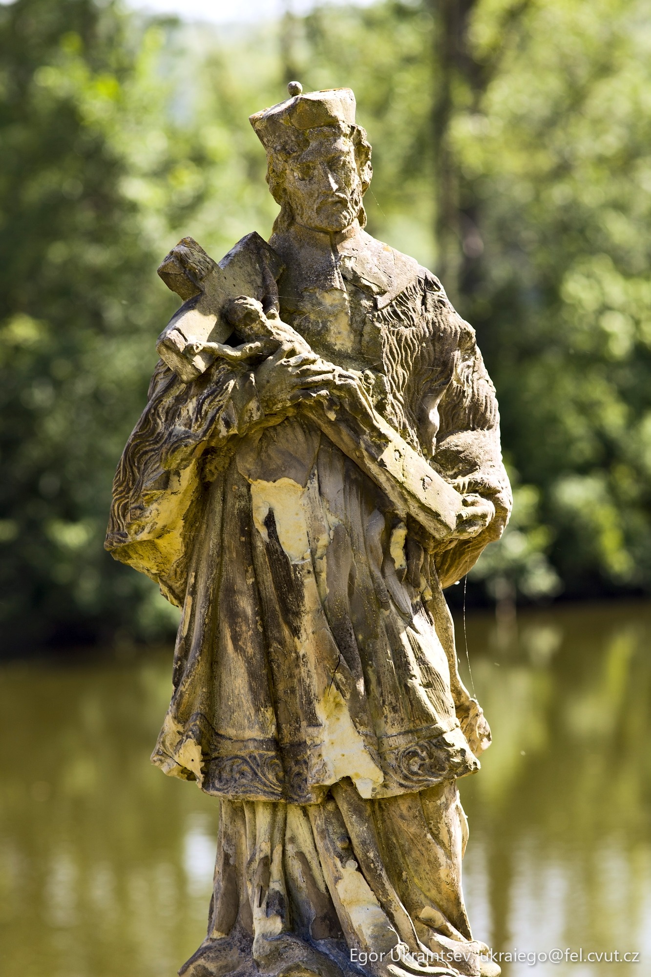 Statue of a man holding