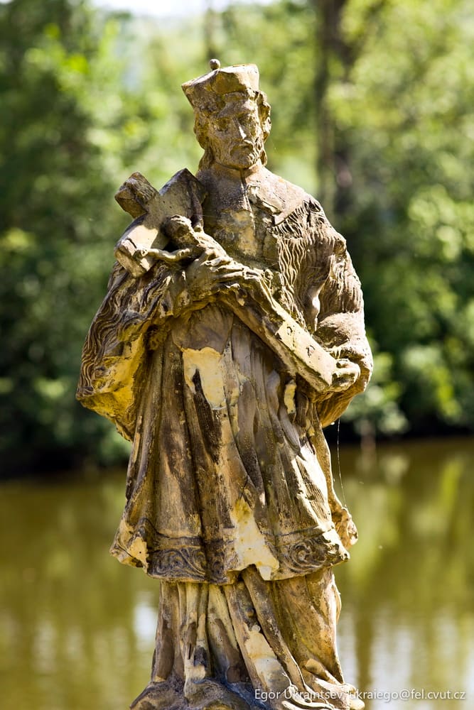 Statue of a man holding