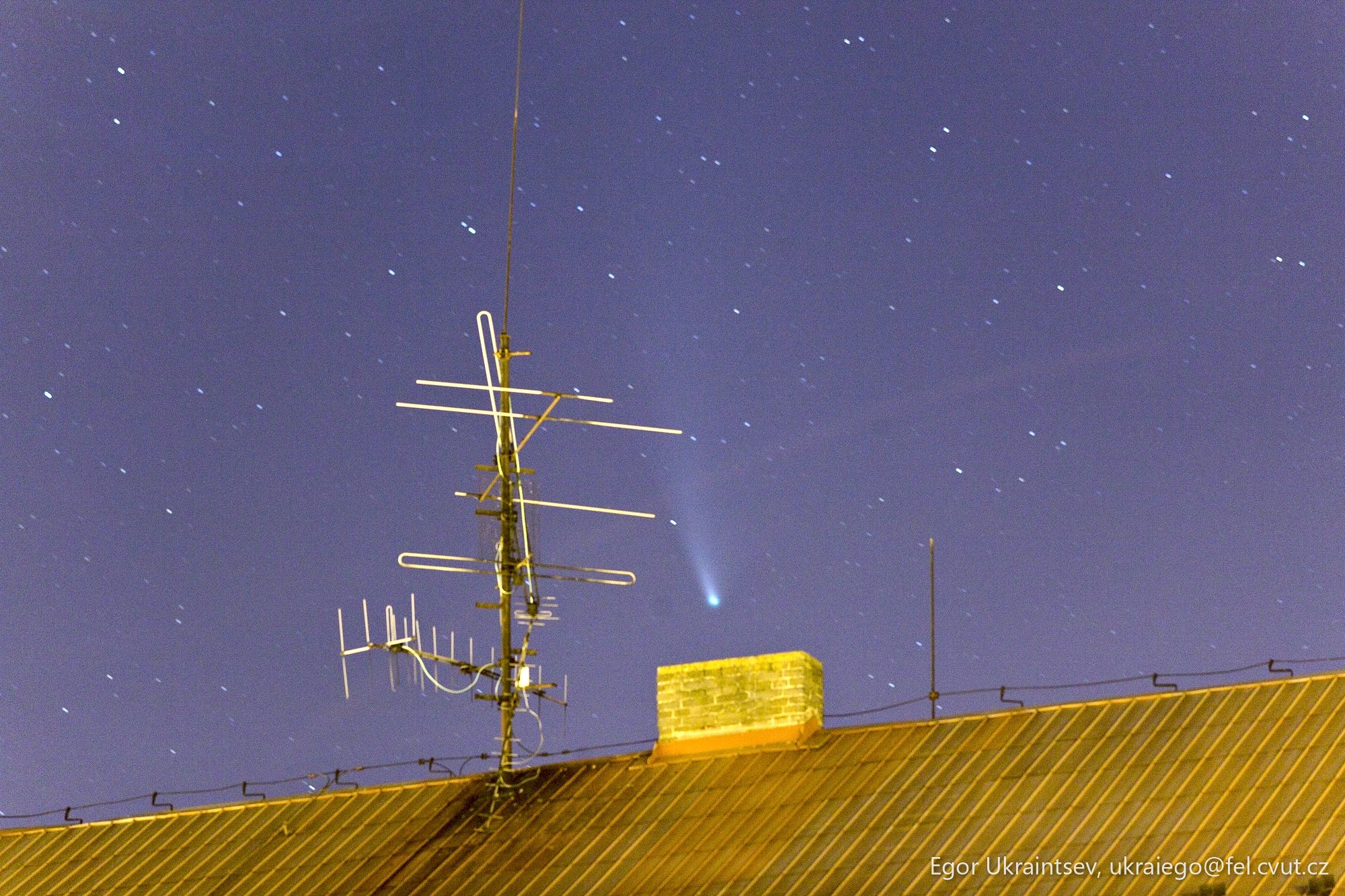 Night sky over a roof