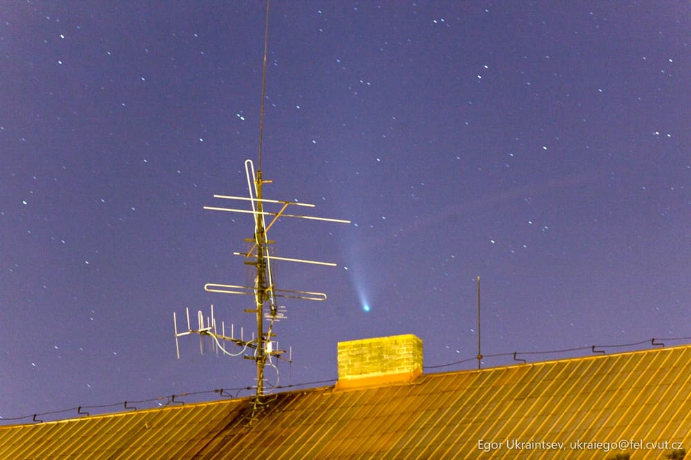Night sky over a roof