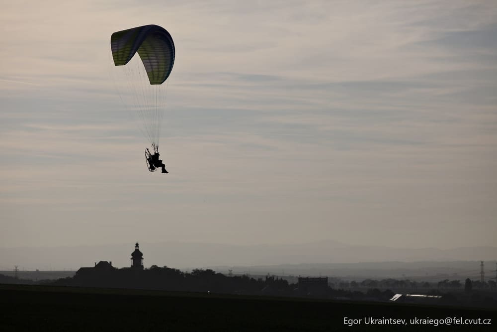 Person parasaiing in the sky