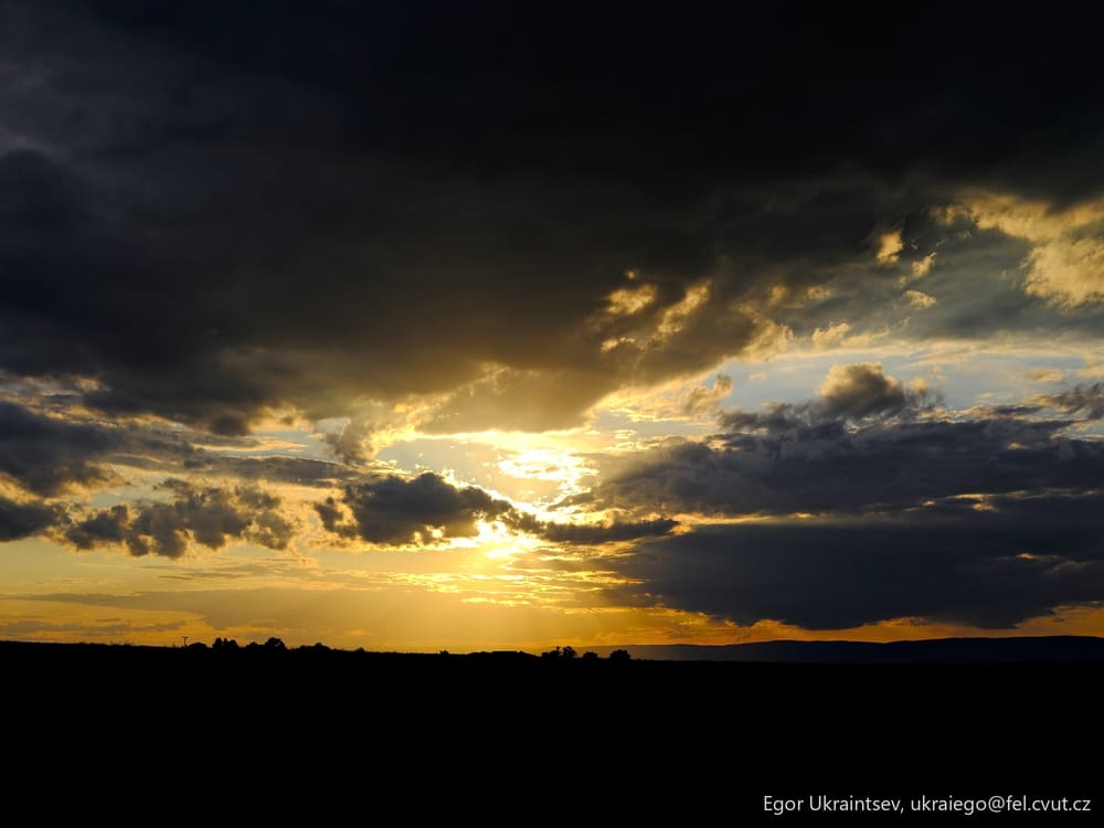 Sun setting behind a dark