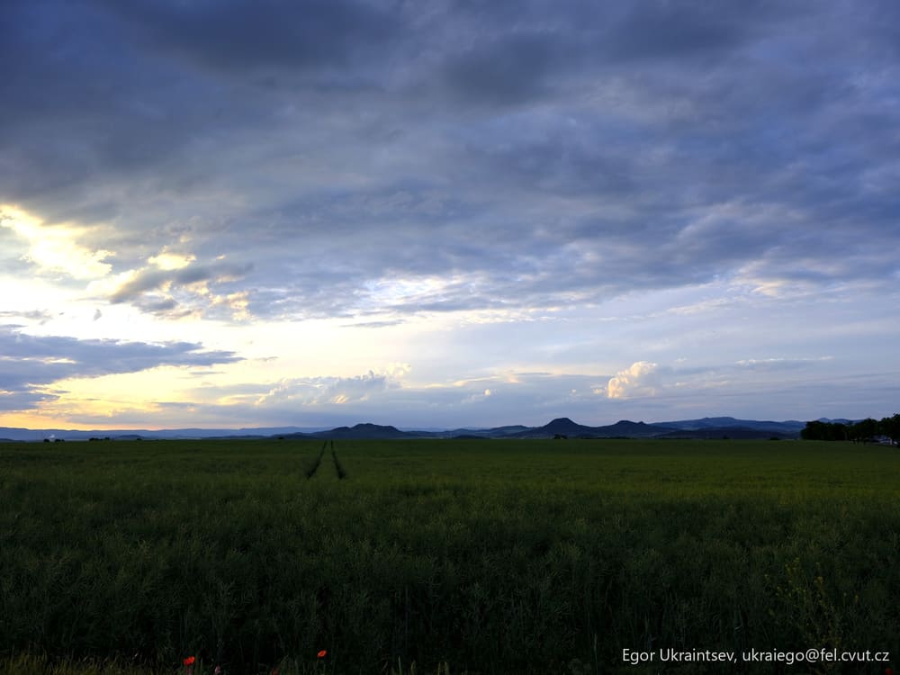 Green field with mountains
