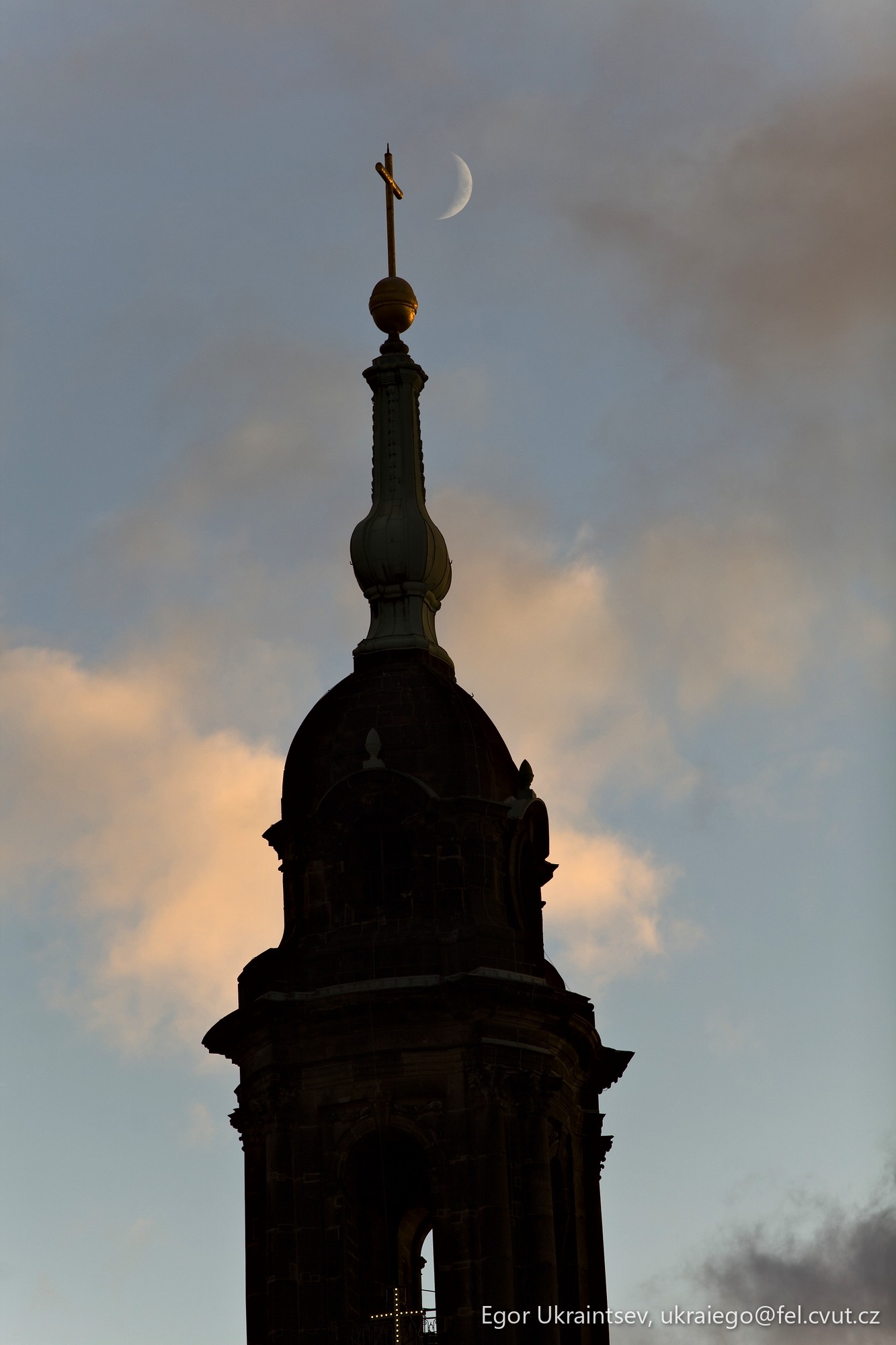 Clock tower with a moon