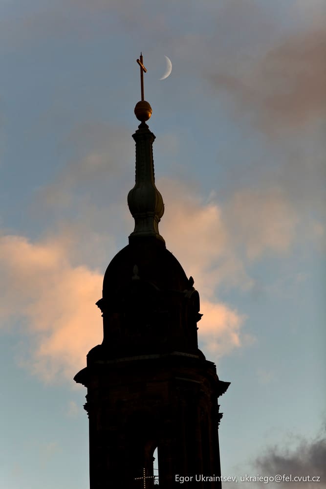 Clock tower with a moon