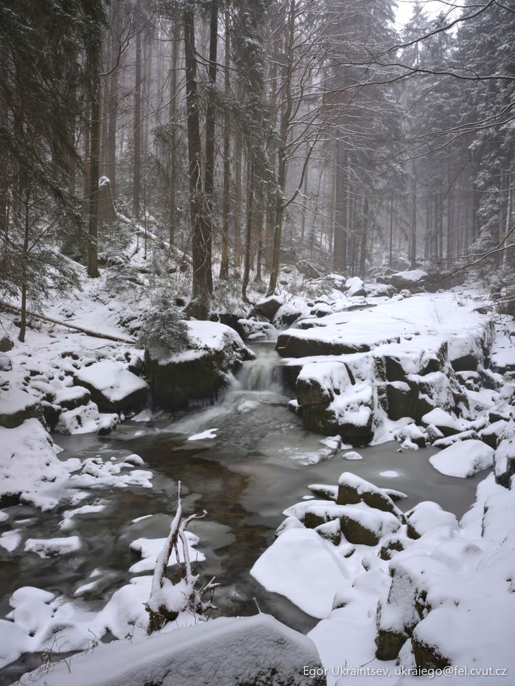 Snowy river in the woods