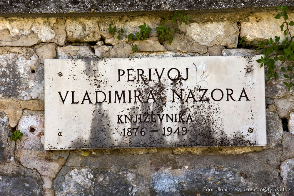 Sign on a stone wall