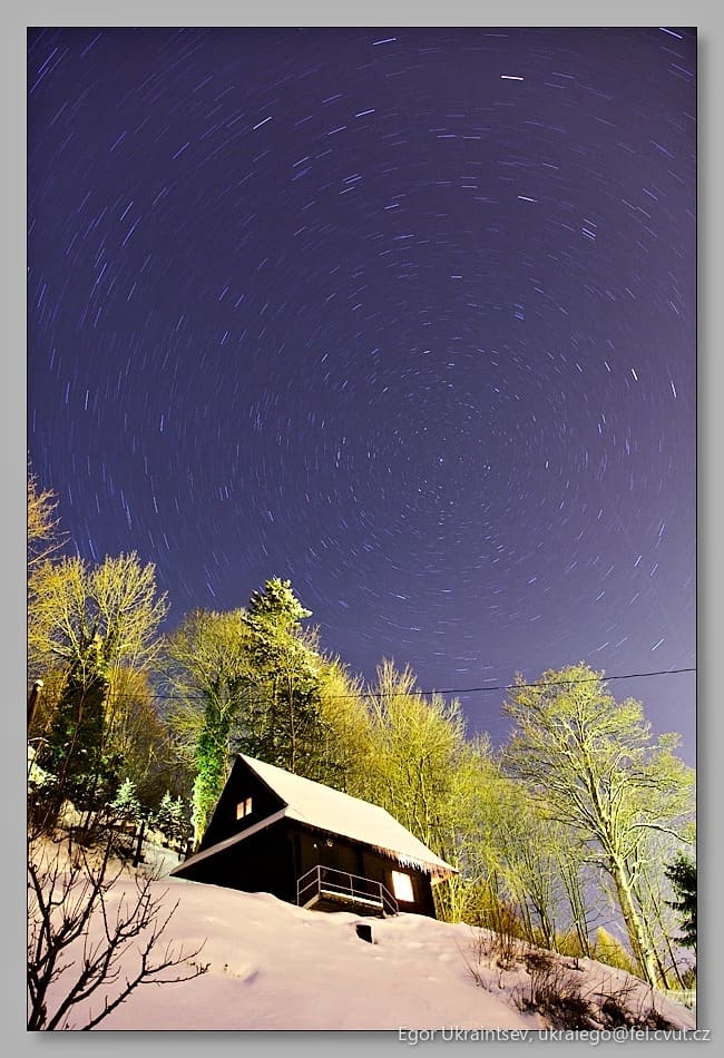 Night sky over a barn