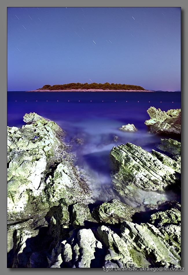 Night sky over a rocky
