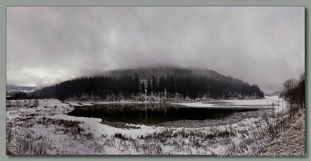 Snowy lake in the mountains