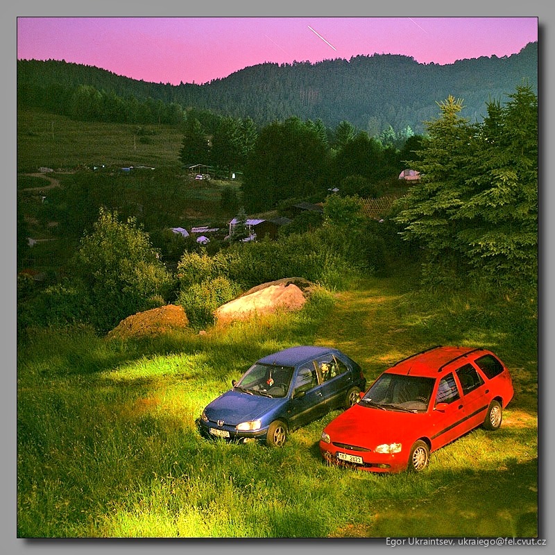 Cars parked in a field