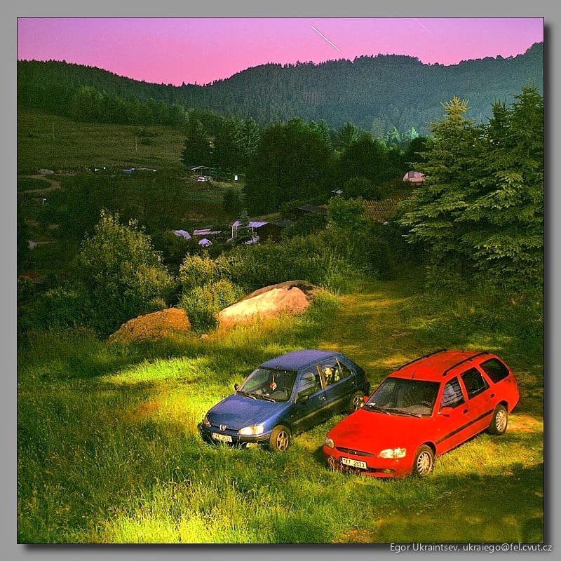 Cars parked in a field