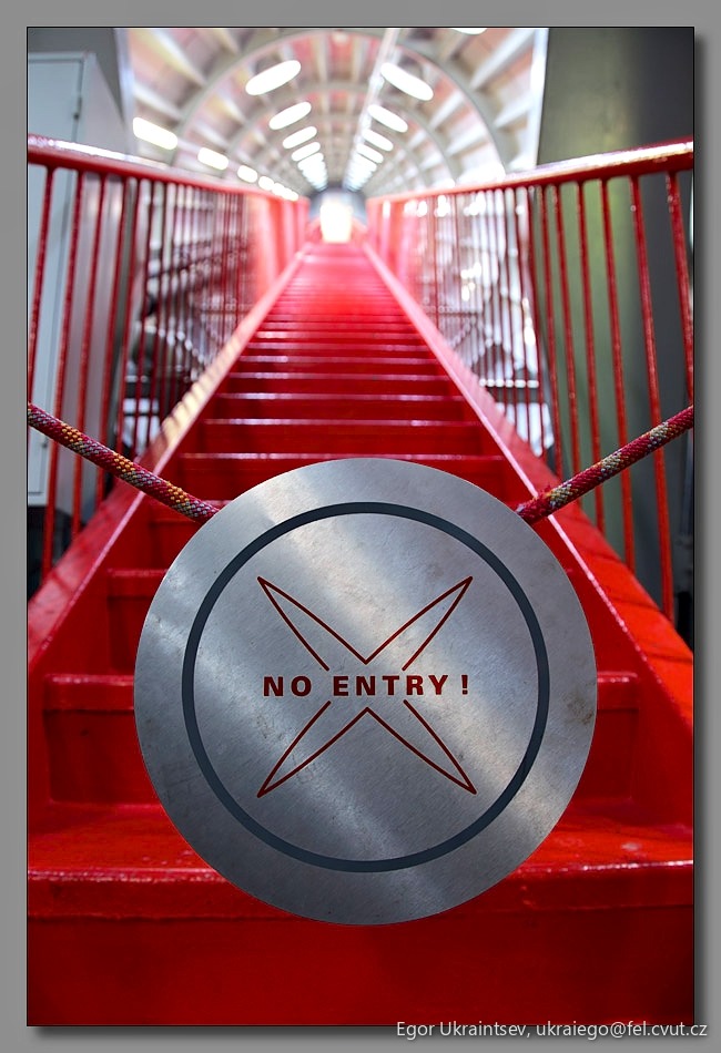 Red staircase with a metal