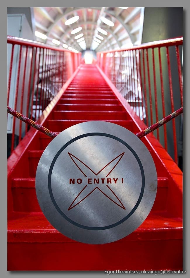 Red staircase with a metal