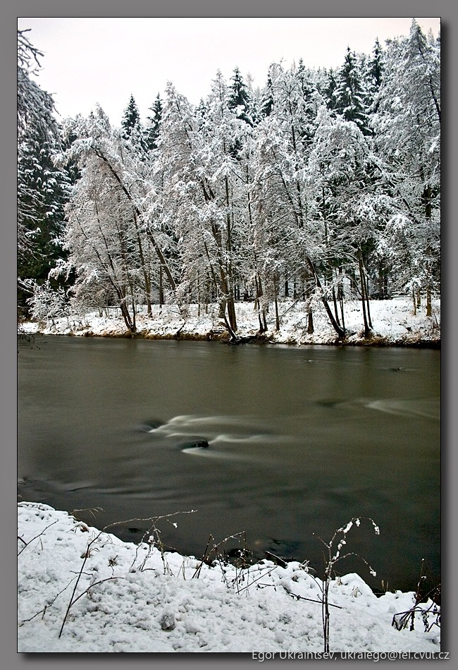 Snowy river in the woods