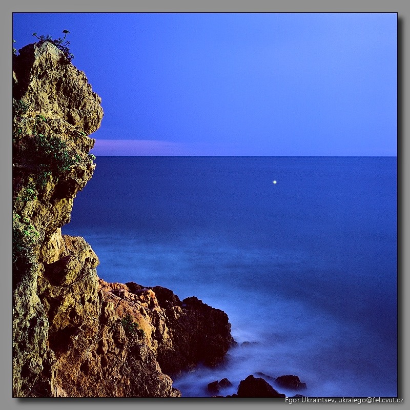 Moon rising over the ocean