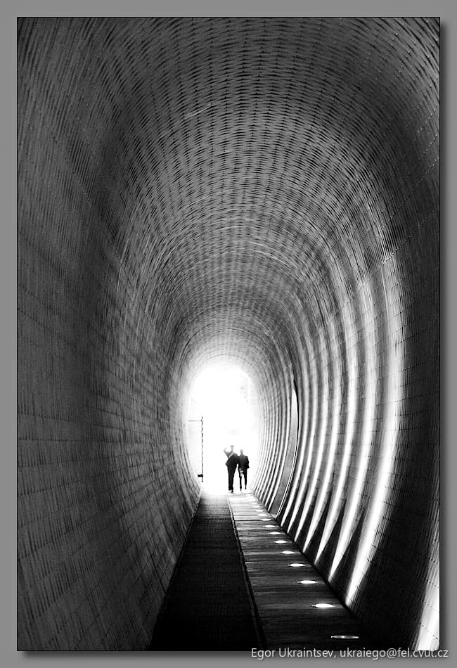 Person walking through a tunnel