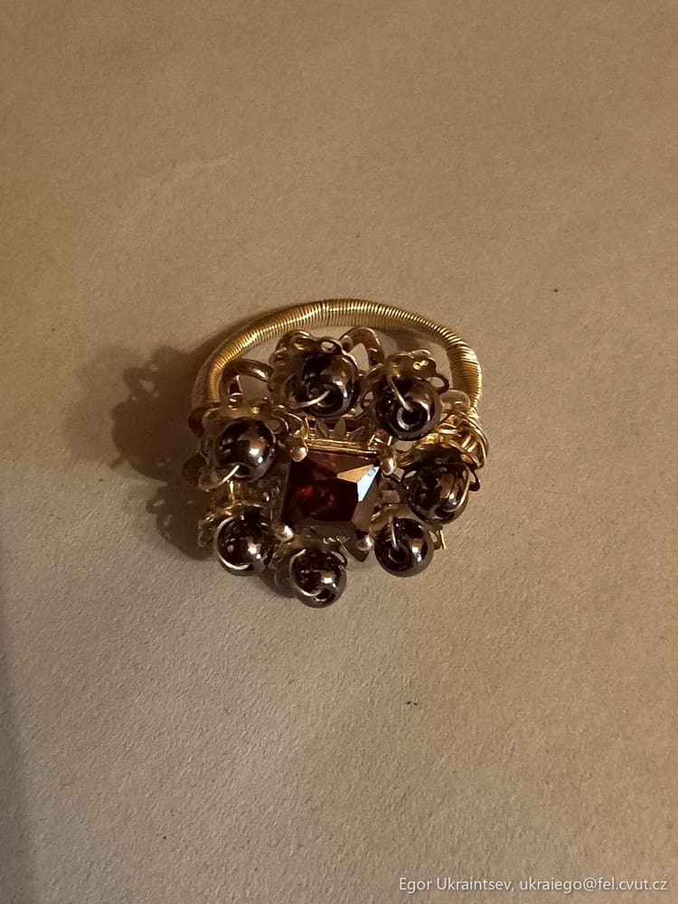 Gold ring with garnet stones
