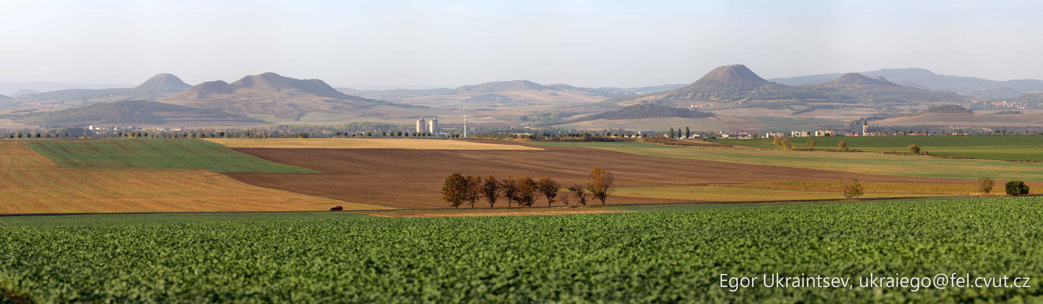 Green field with mountains · Haj