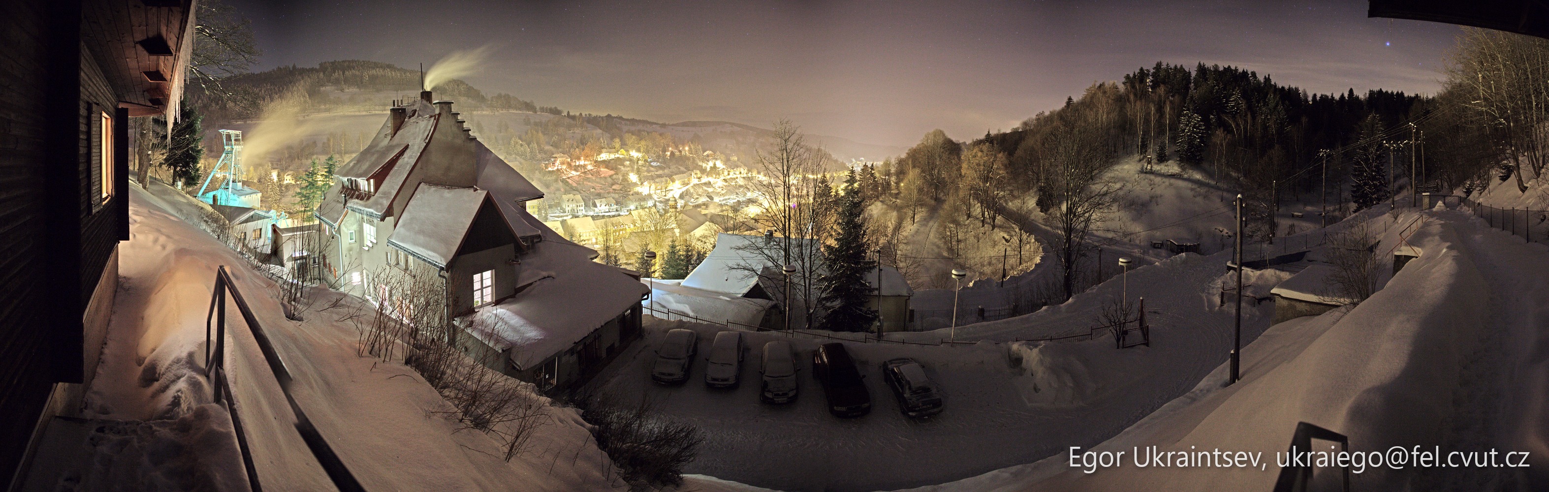 Snowy village at night
