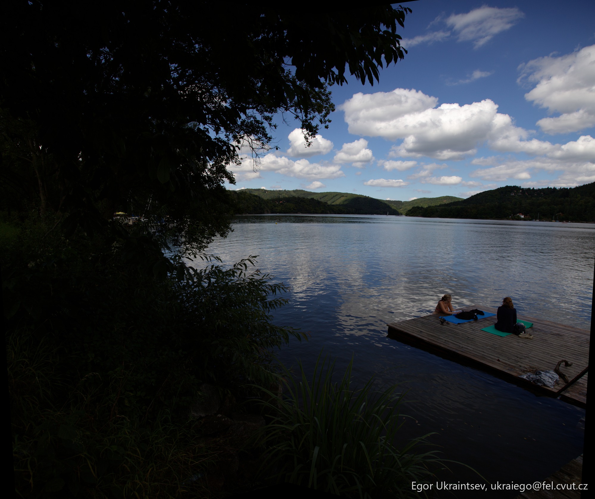 Man relaxing on a dock · Slapy